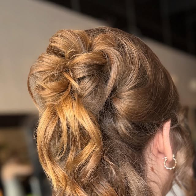 Textured curled updo with copper tones